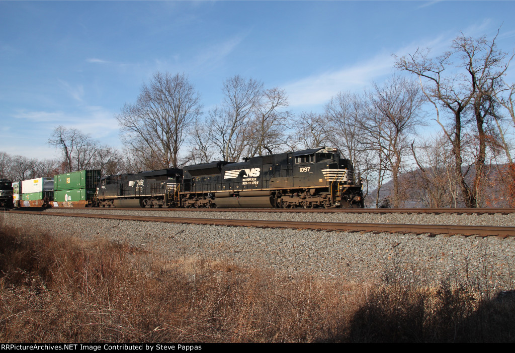 NS 1097 takes a container train east past MP116